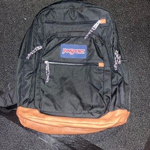JanSport Black Backpack with Brown Base